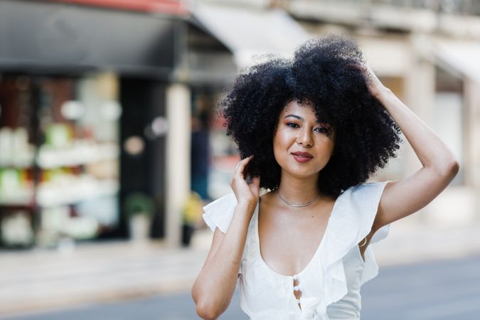 Black female looking at camera in urban background