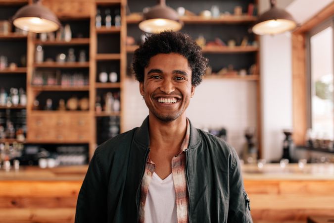Smiling young male in a coffee shop