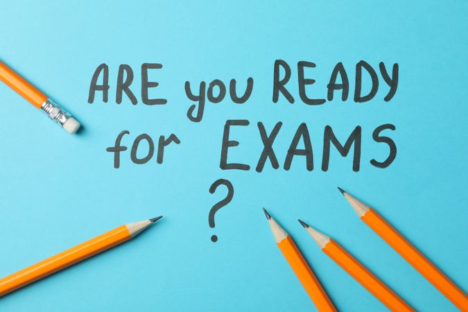 “Are you ready for exams” written on blue background with pencils