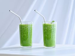 Glasses with green refreshing smoothies