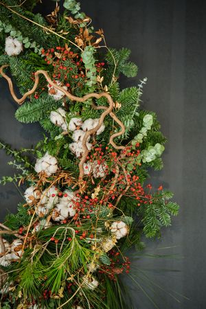 Composition of green branches on gray background