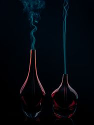 Glass bottles emitting smoke