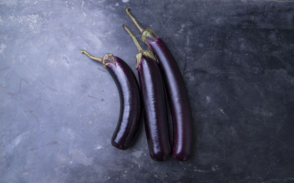 Fresh eggplant on a concrete Floor