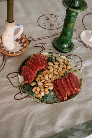 Plate of cured meat and almonds