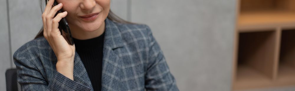 Wide shot of woman on phone with copy space