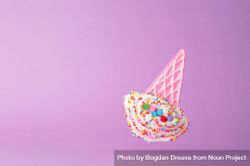 Cute falling ice cream cone toy on purple background 0Jl6Z4