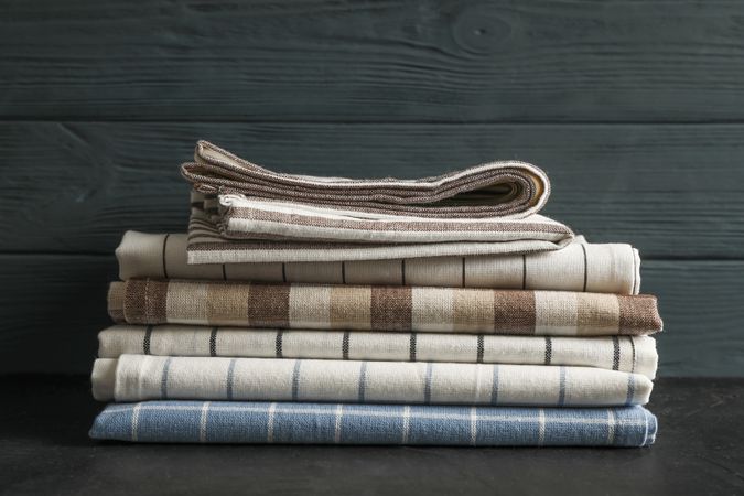 Stack of fabric napkins on table, space for text