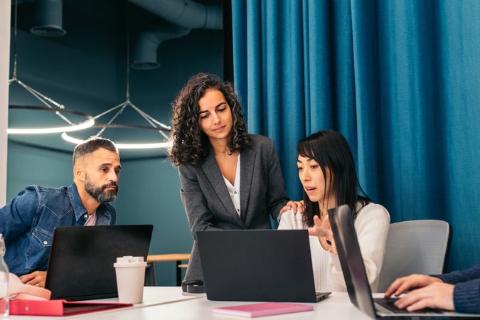 Group of people working with laptop in a coworking