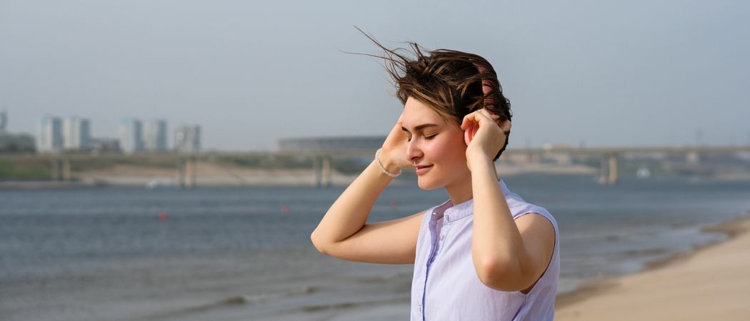 Woman listening to music in headphones outdoors