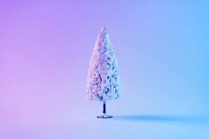 Snowy Christmas tree in vibrant bold gradient holographic colors