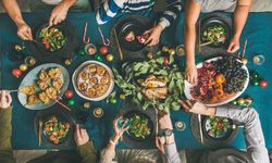 Christmas or New Year party dinner at festive table, celebrating holiday, top view
