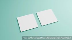 Square paper cards on mint green background, copy space 561wx0