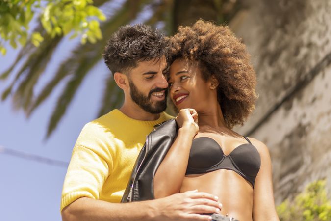 Happy couple flirting on street
