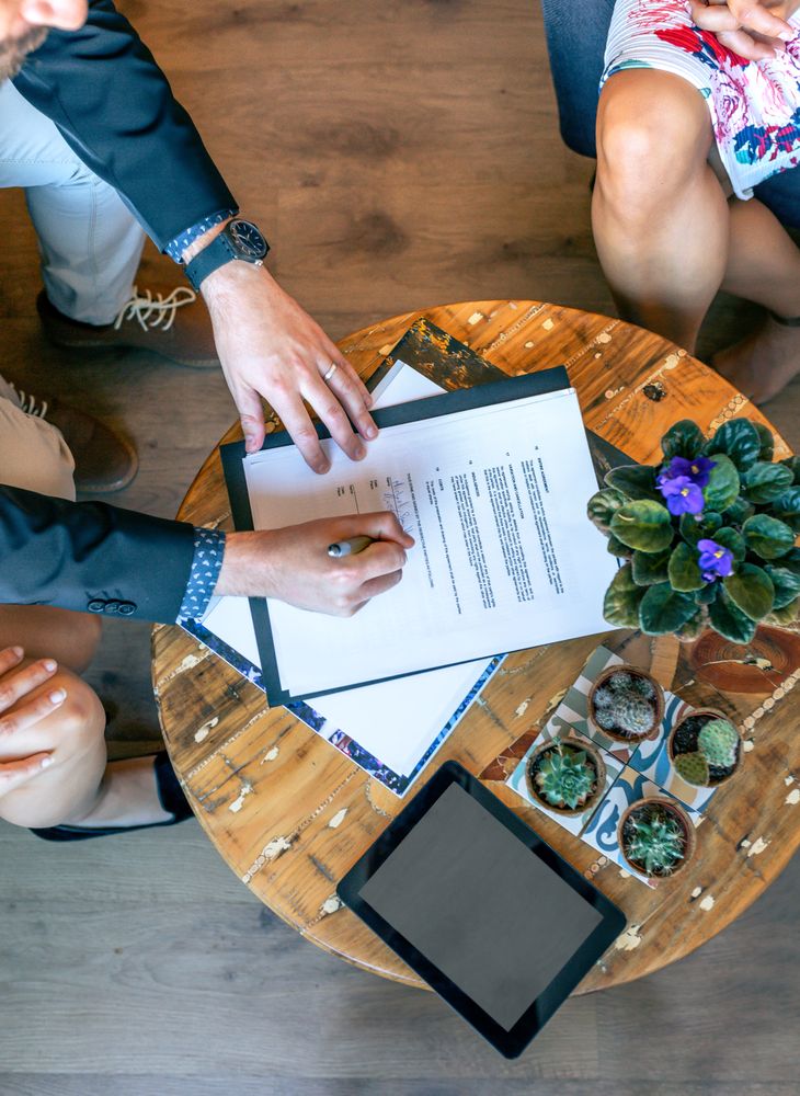 Top view of man signing a document