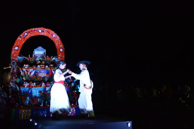 Two people dancing in Folklorico attire