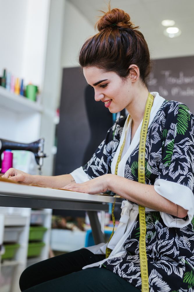 Woman in a sewing school