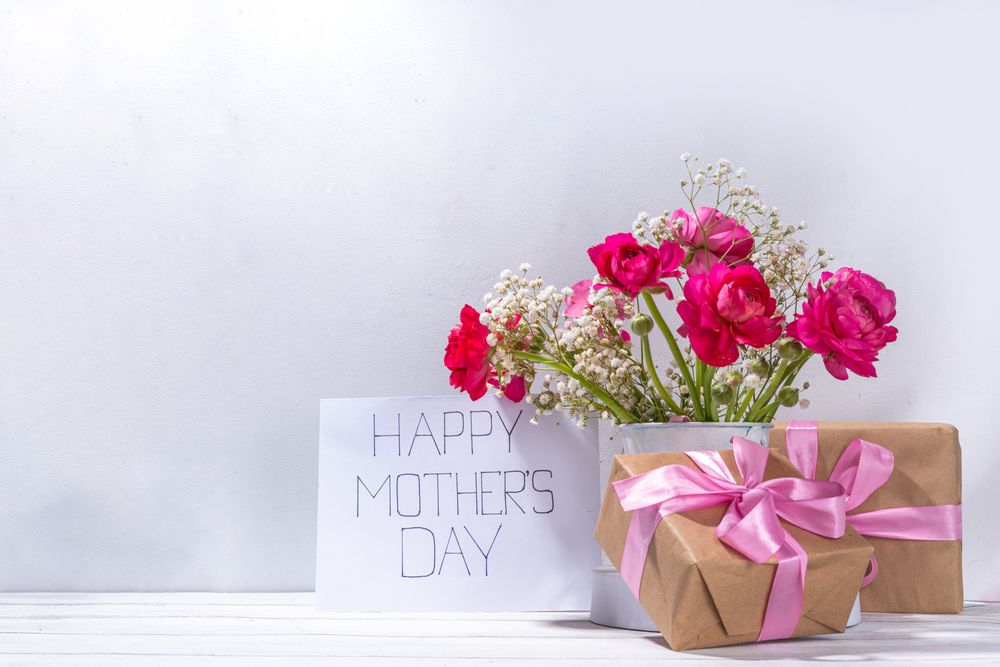 Mothers day gift and flowers background