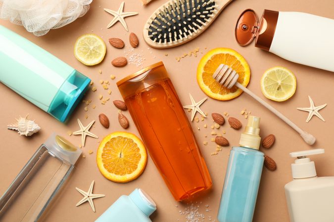 Hygiene composition with shampoo bottles on craft background