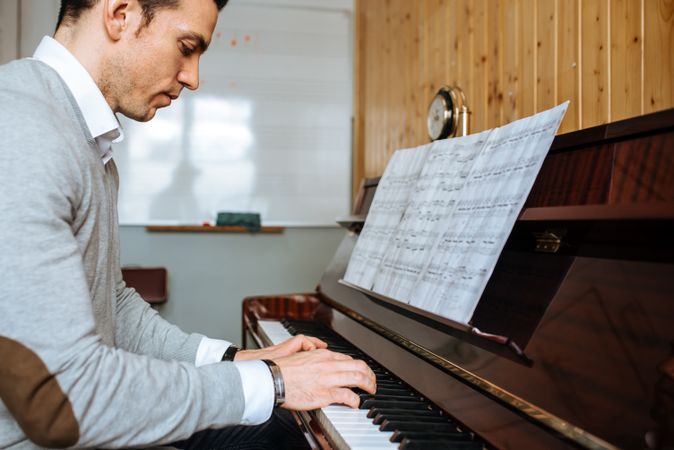 Man playing piano in studio