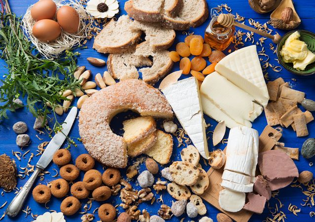 Knife and various breakfast food on table