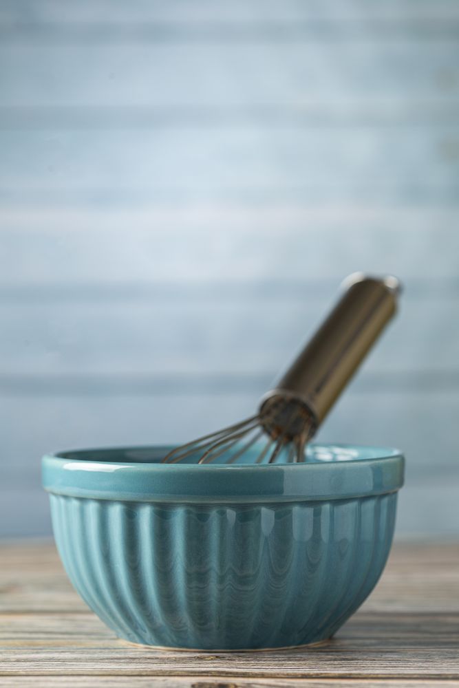 kitchen utensils on wooden background.