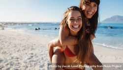 Young females enjoying summer break at the beach 43zqr5