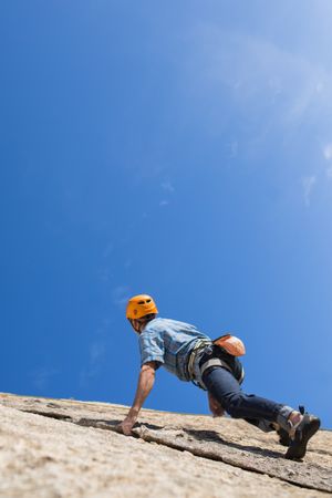 Free climber climbing in nature