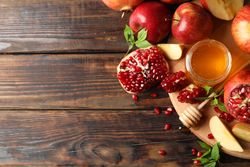 Autumnal fruits ready for baking on wooden table with copy space