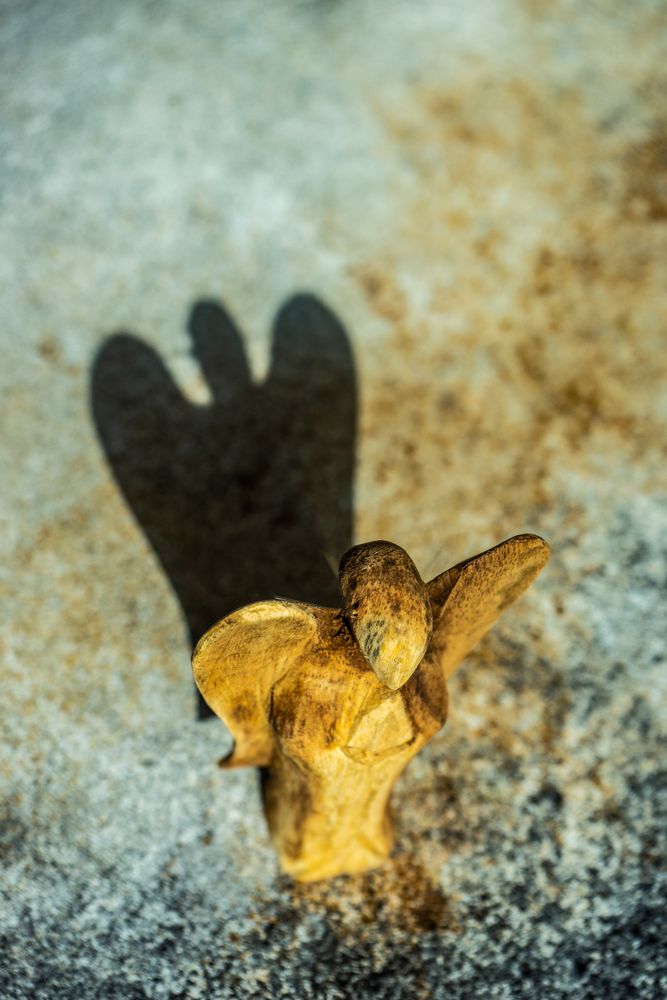 Angel shaped ornament with shadow