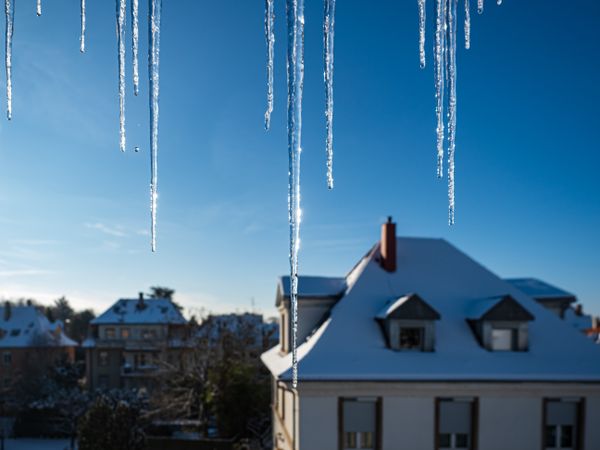 Icicles hang from the roof. Thaw. Spring