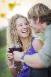 A Smiling Couple Enjoying A Glass Of Wine in the Park