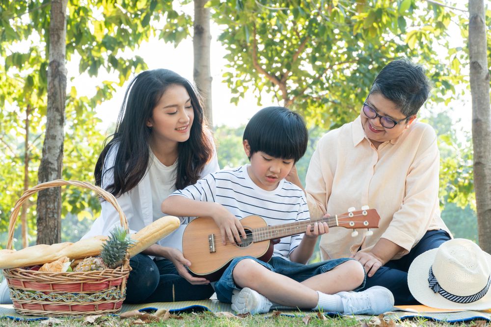 Family having fun together at park on weekend