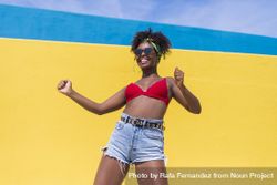 Fun Black woman laughing with arms raised 41lJKg