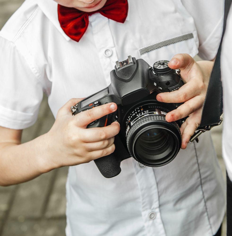 Boy holding a camera