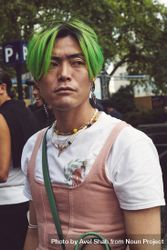 London, England, United Kingdom - September 18 2021: Asian man with green hair 42X7x0