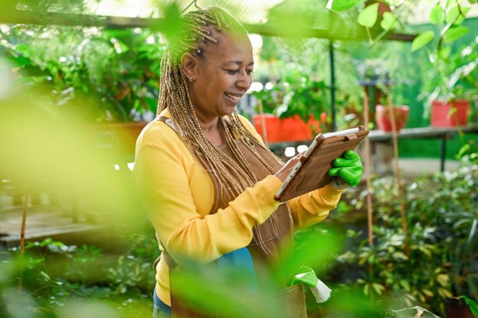 Cheerful woman using tablet