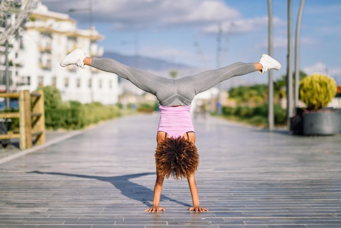 Back of woman in handstand