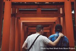 Tokyo, Japan - November 19th, 2019: Two men stand below a torii gate 5Q2Og4