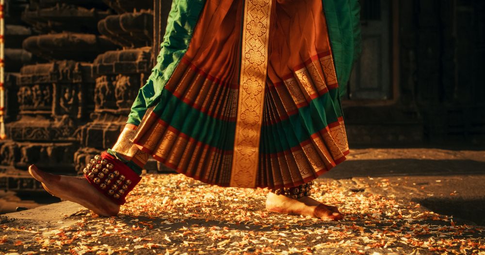 Portrait of CInematic Group of Indian Women Joyfully Dancing Traditional Folk Dance Outside of Authentic Temple.