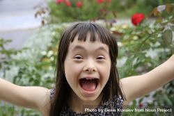 Happy little girl extending arms out with excitement 5ogKx5
