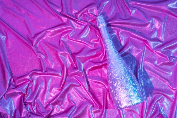 Holographic abstract pastel colors backdrop with Champagne bottle, horizontal composition