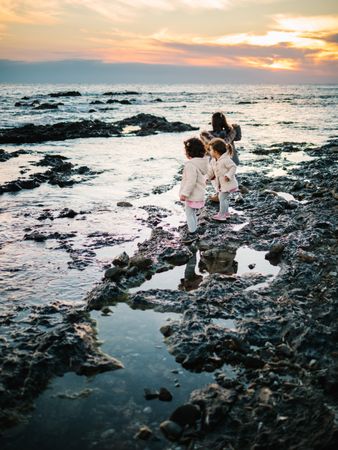 back view of little girls looking at sea