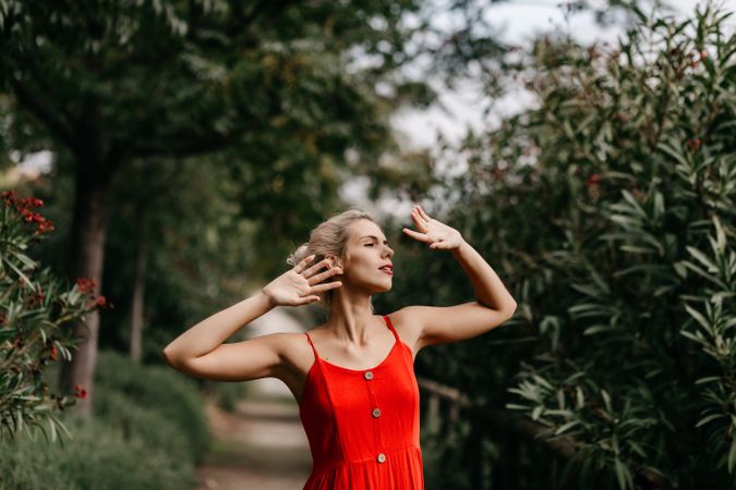 Dreamy young woman in summer garden
