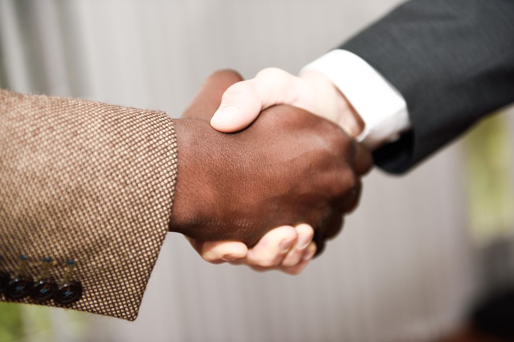 Two male businessmen shaking hands