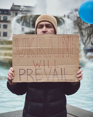 London, England, United Kingdom - March 5 2022: Man with “Ukraine with Prevail” sign
