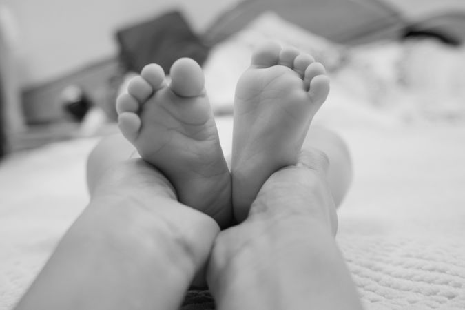 Mom holding her baby's feet