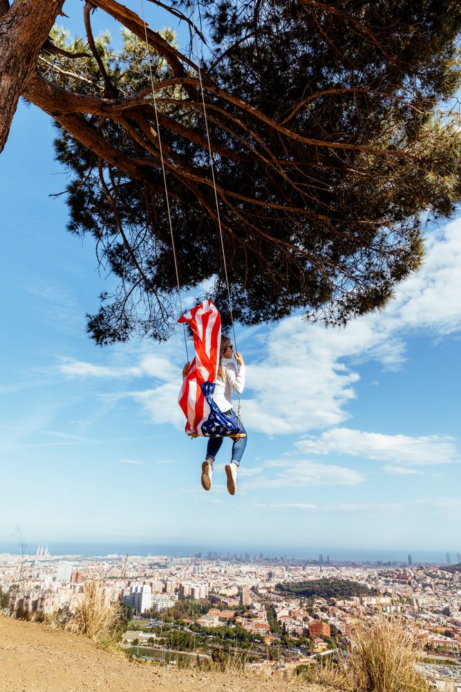 Woman with American flag on swing
