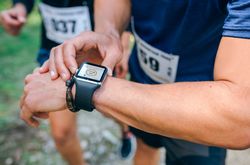 Sportsman looking a smartwatch