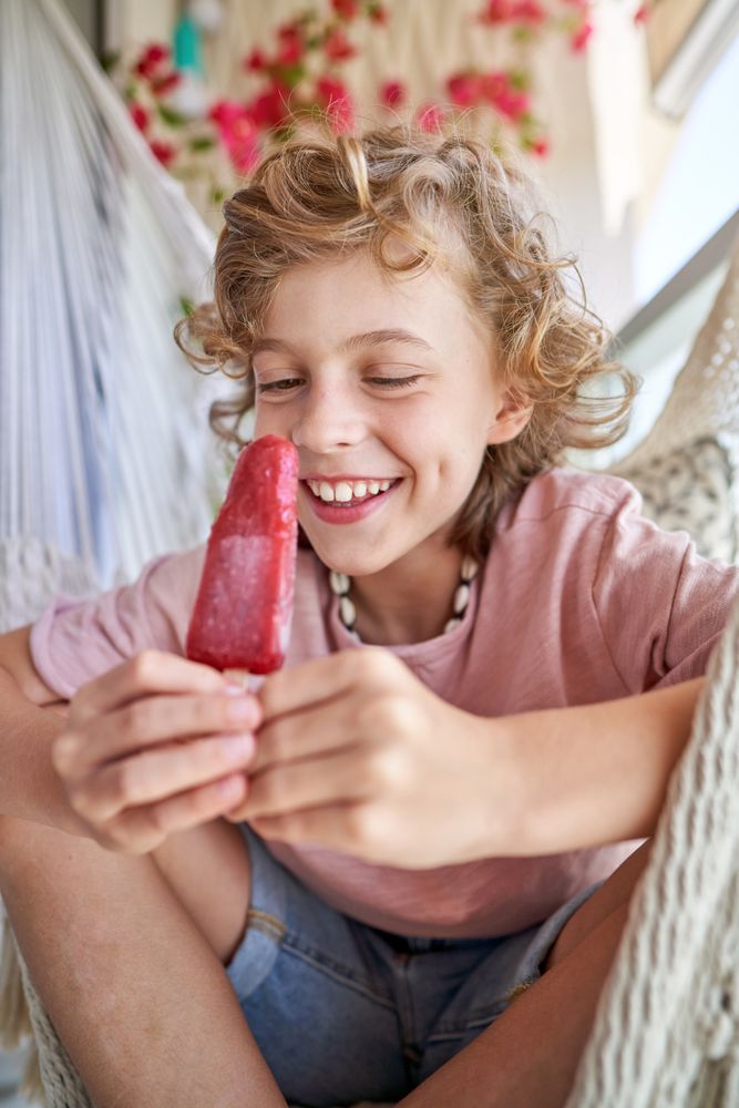 Delighted kid looking at ice cream