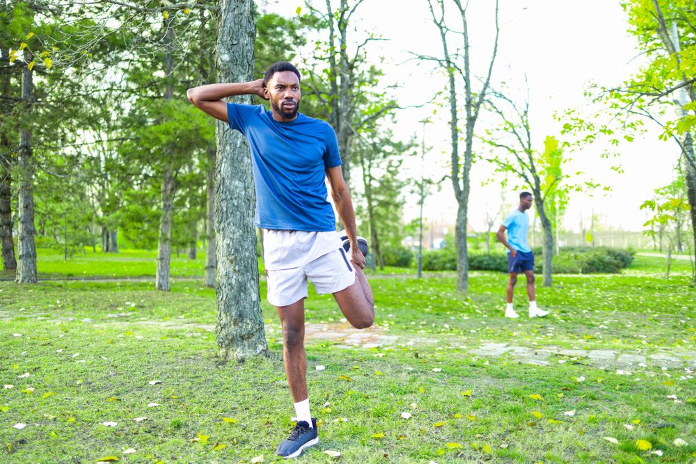 Friends Stretching Together in Spring Morning Light